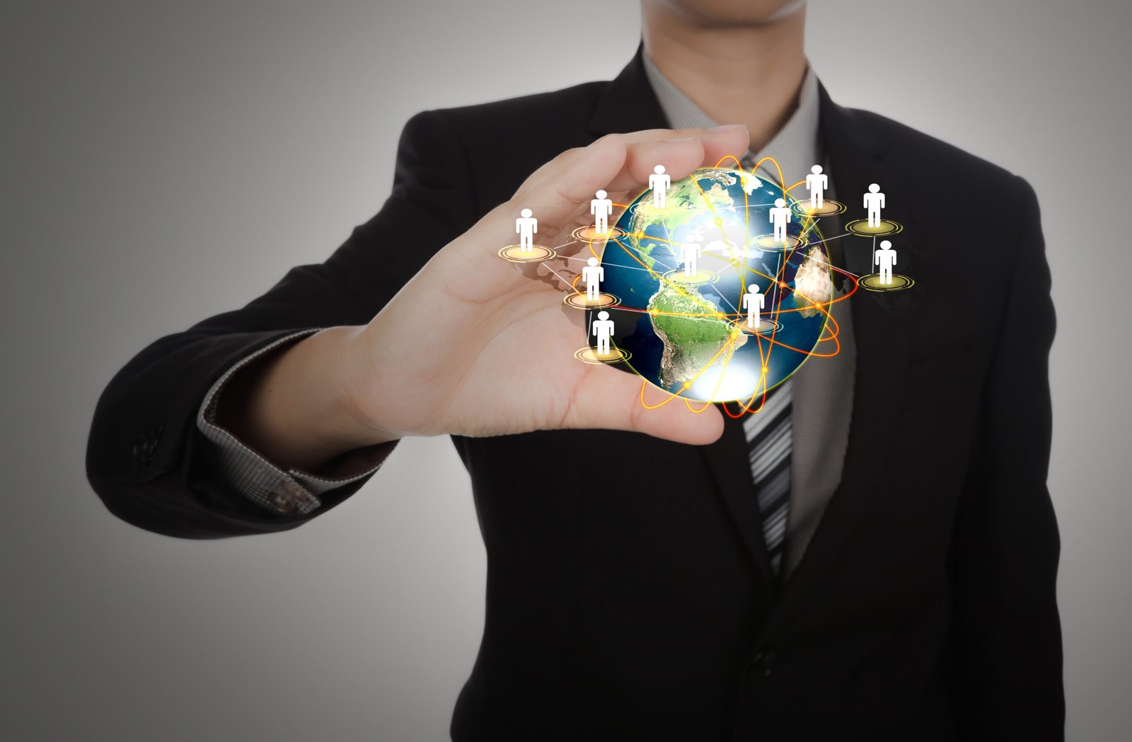 About Us business man holding the small world in his hands against white